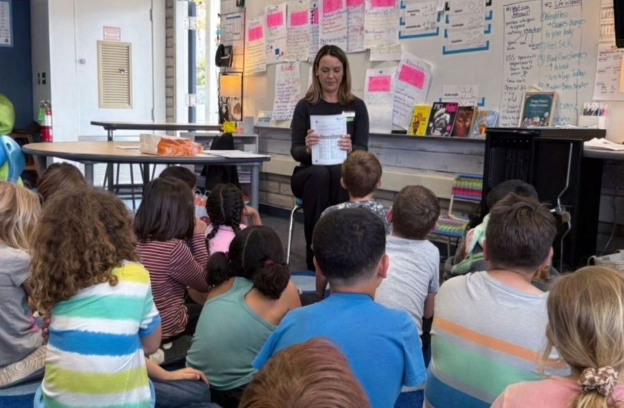 arb volunteer holly onak presenting for teach children to save at local schools